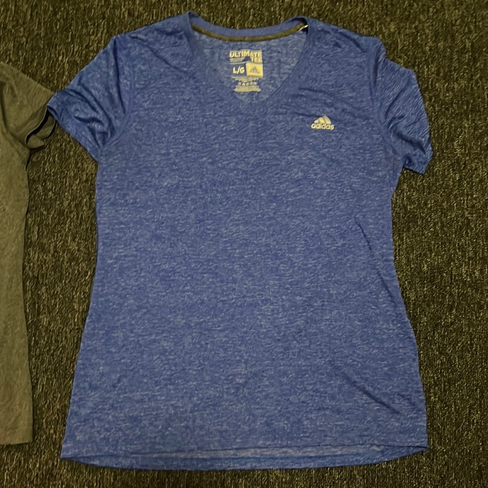 Under Armour and Adidas athletic shirts.